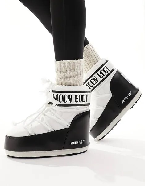 Черно-белые зимние ботинки до середины щиколотки Moon Boot