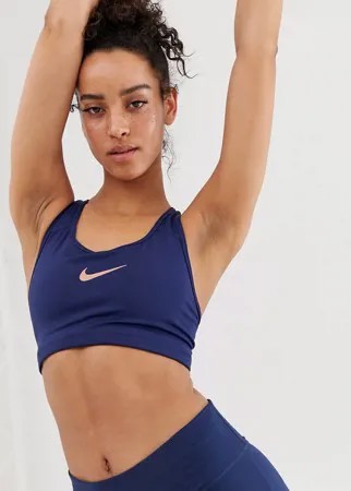 Темно-синий бюстгальтер с розово-золотистым логотипом-галочкой Nike Pro Training