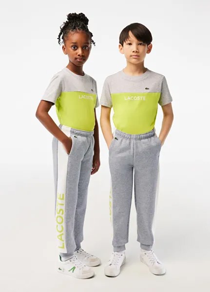 Серые детские спортивные штаны с цветными блоками Lacoste
