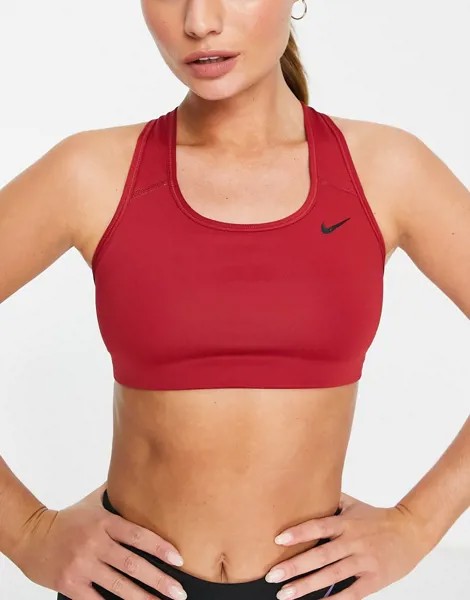 Красный спортивный бюстгальтер без уплотнителя средней степени поддержки с логотипом-галочкой Nike Training-Розовый цвет