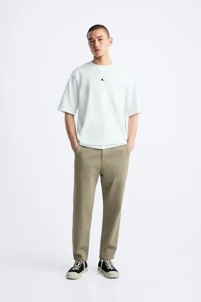 Джинсы с нарушенным кроем ZARA, хаки