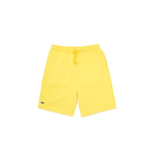 Мужские желтые спортивные теннисные флисовые шорты Lacoste
