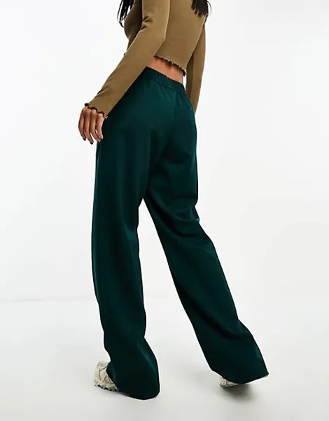 Темно-зеленые брюки-клеш с высоким воротником Monki