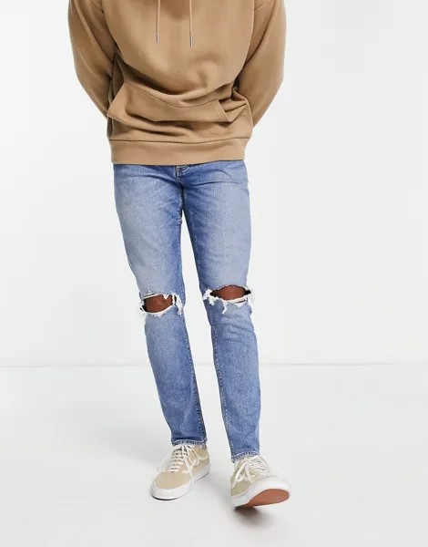 Эластичные узкие джинсы голубого цвета со рваной отделкой на коленях ASOS DESIGN-Голубой