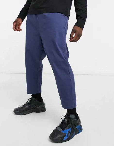 Темно-синие брюки чиносы с заниженным шаговым швом ASOS DESIGN-Темно-синий