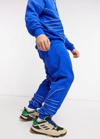 Синие джоггеры с большим контуром логотипа-трилистника adidas Originals-Синий