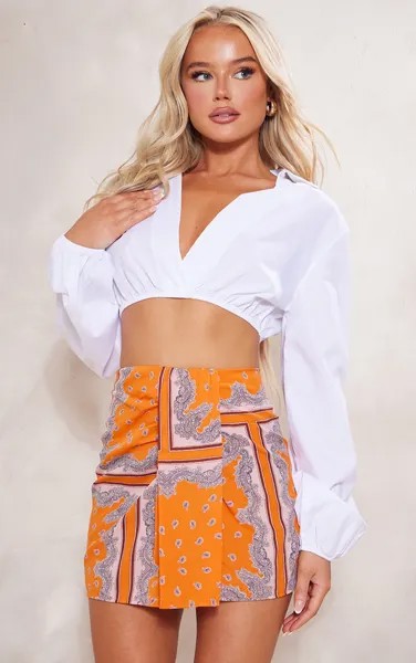 PrettyLittleThing Оранжевая мини-юбка с драпировкой спереди ацтекского принта