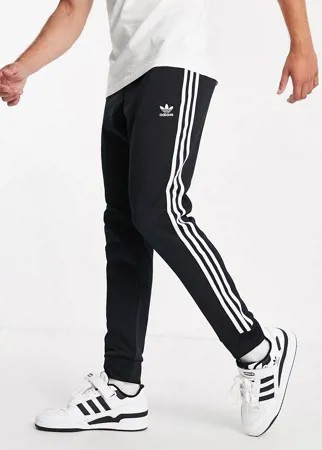 Черные зауженные джоггеры с тремя полосками adidas Originals adicolor-Черный цвет