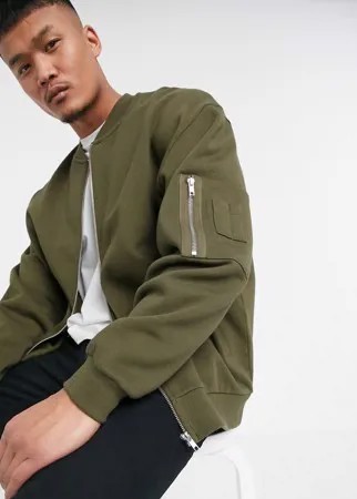 Трикотажный oversized-бомбер цвета хаки с карманом MA1 ASOS DESIGN-Зеленый