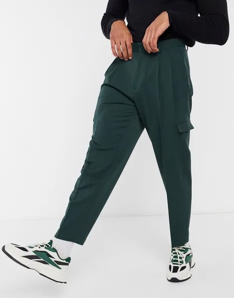 Темно-зеленые oversized-брюки зауженного книзу кроя с карманами-карго ASOS DESIGN-Зеленый