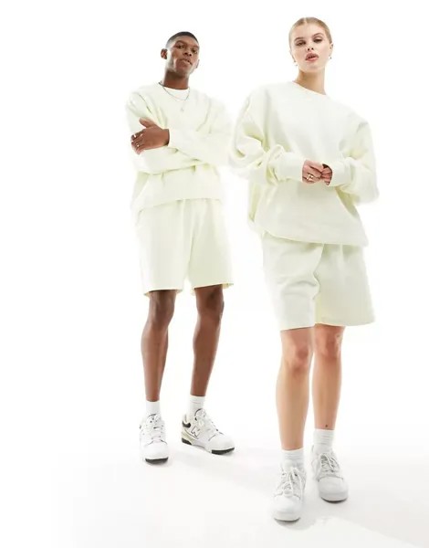 Бледно-желтые шорты из джерси унисекс Weekday, эксклюзивно для ASOS