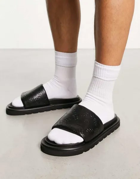 Черные шлепанцы из искусственной кожи с тиснением монограммы ASOS DESIGN