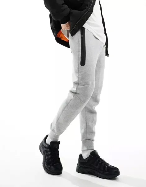 Серые джоггеры Nike Tech Fleece
