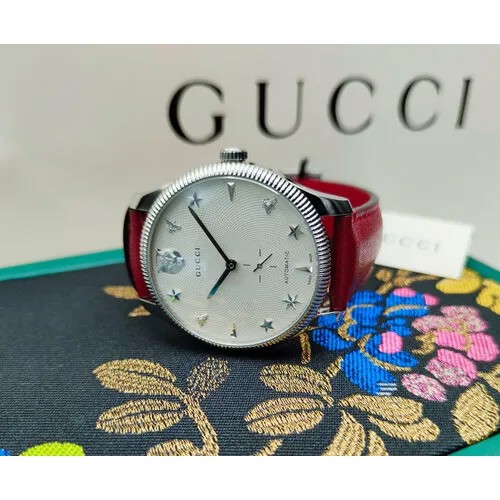 Наручные часы GUCCI Часы женские Gucci G-Timeless YA126346. Наручные механические часы с автоподзаводом производства Швейцария, белый, красный