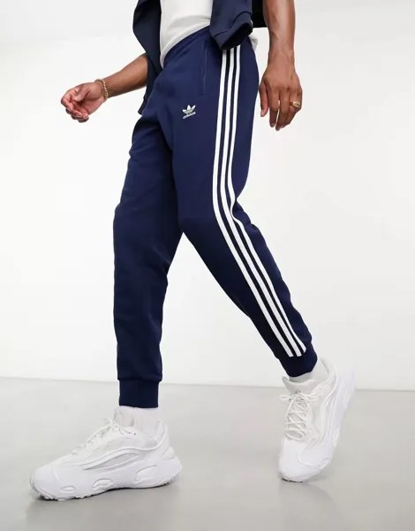 Темно-синие джоггеры с тремя полосками adidas Originals adicolor