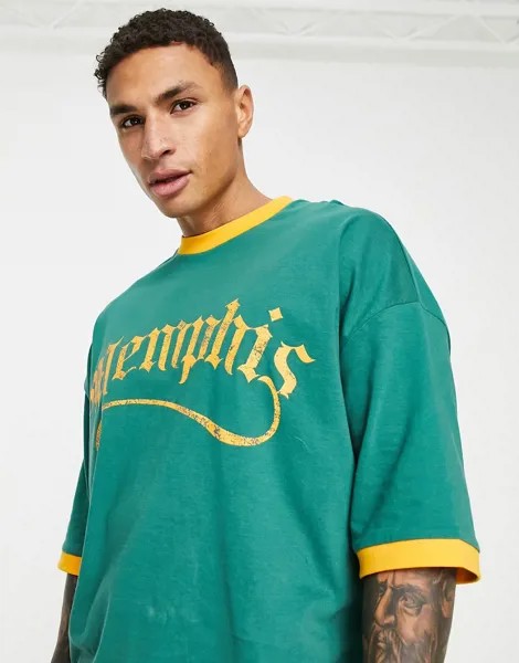 Зеленая футболка в стиле oversized с контрастным кантом и принтом 