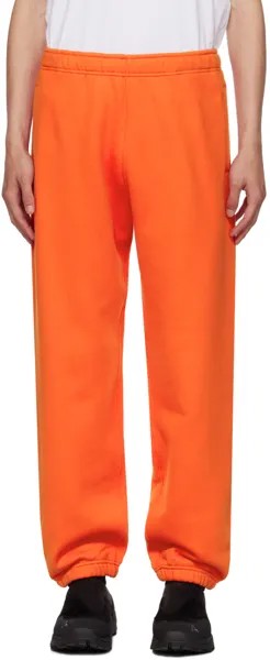 Оранжевые спортивные штаны на кулиске Stone Island