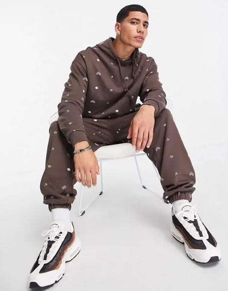 Коричневые джоггеры в стиле oversized со сплошным принтом символов (от комплекта) ASOS DESIGN-Разноцветный
