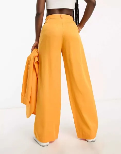 Оранжевые широкие брюки Monki