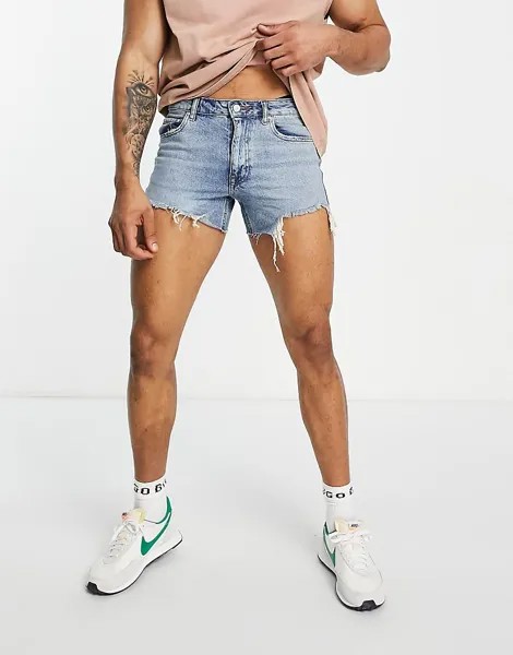 Укороченные джинсовые шорты ASOS DESIGN в стиле 90-х с рваными деталями и необработанным краем по краю