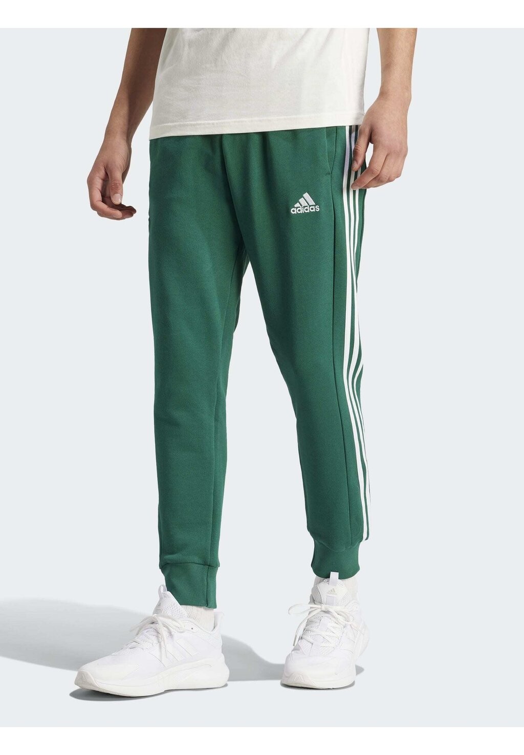 Спортивные брюки Essentials Tapered Cuffed 3-Stripes adidas Sportswear, цвет collegiate green