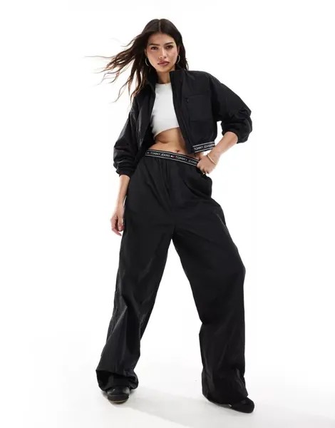 Черные широкие спортивные брюки с декоративной лентой Tommy Jeans