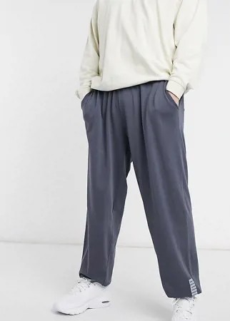 Синие выбеленные джоггеры в стиле oversized с логотипом Puma Plus эксклюзивно для ASOS-Черный