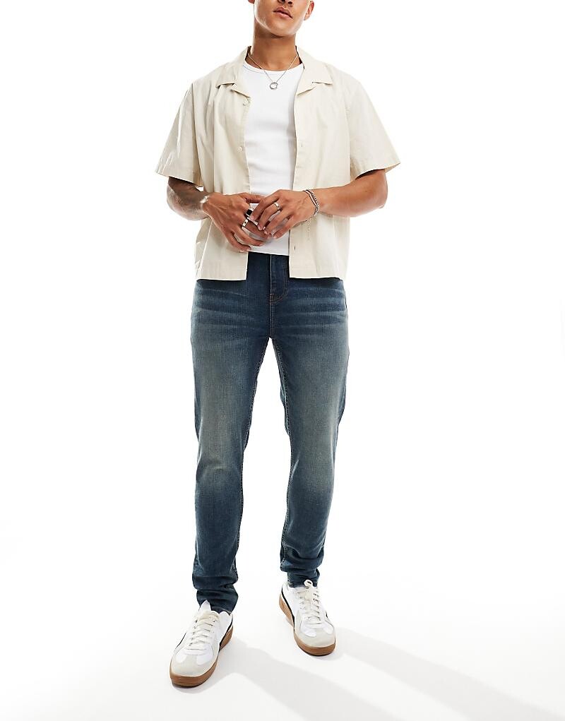 Темно-синие джинсы скинни ASOS DESIGN