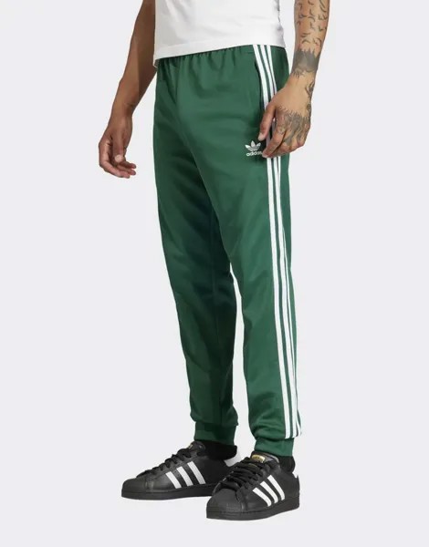 Зеленые спортивные брюки adidas Superstar