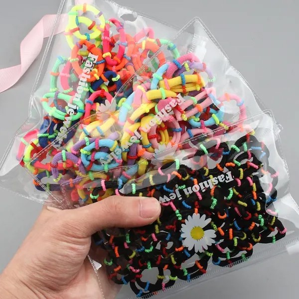 50Pcs Женщины Радужная резиновая лента Кольцо для волос Набор аксессуаров для волос Эластичные конфеты Цвет Головная веревка Девушки Модные волосы Браслеты Головной убор