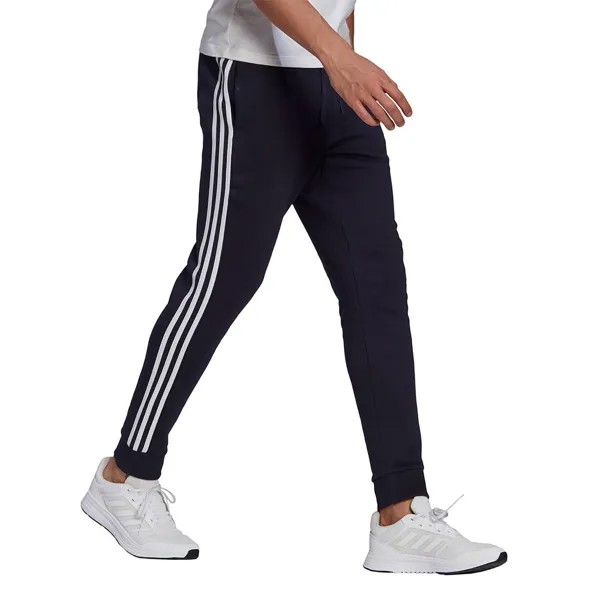 Брюки adidas Essentials Fleece Tapered Cuff 3-Stripes, синий
