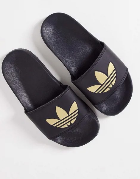 Легкие черные шлепанцы с золотистым логотипом-трилистником adidas Originals Adilette-Черный