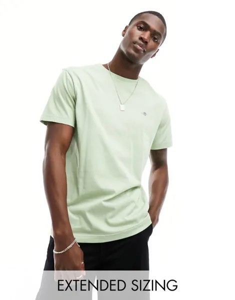 Gant — светло-зеленая футболка с логотипом в виде щита