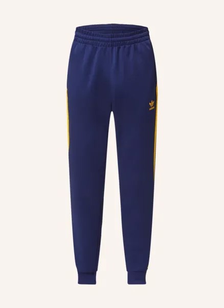 Спортивные брюки adicolor classics+ sst с галлонными полосками Adidas, синий