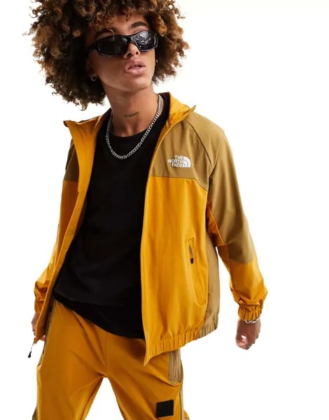 Желто-коричневая спортивная куртка The North Face NSE