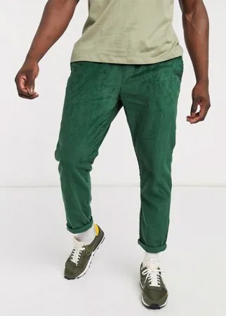 Зеленые вельветовые брюки узкого кроя с эластичным поясом ASOS DESIGN-Зеленый