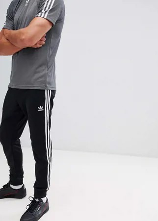 Черные зауженные джоггеры с манжетами adidas Originals Superstar cw1275-Черный цвет