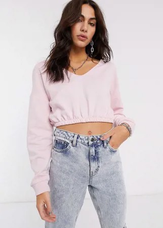 Розовый короткий свитшот с эластичным нижним краем Bershka