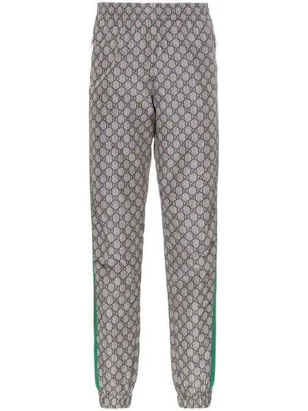 Gucci спортивные брюки с узором GG Supreme и отделкой Web