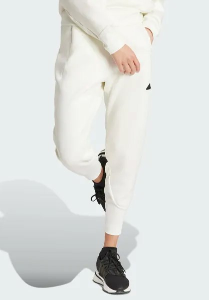 Спортивные штаны adidas Sportswear З.Н.Е., кремового цвета.