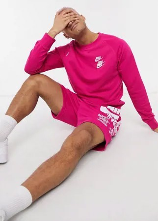 Розовый свитшот с круглым вырезом и графическим принтом Nike World Tour Pack-Розовый цвет