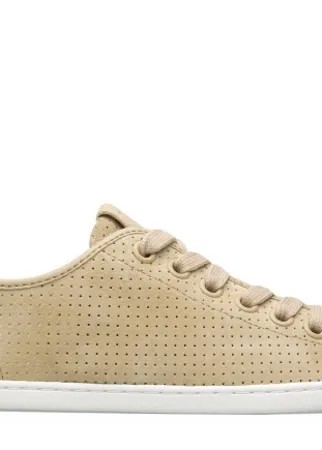 Beige sneaker for women. Nubuck upper perforated with laces and rubber outsole.  Our Uno low-top sneakers feature a sleek silhouette and breathable perforated leather uppers.