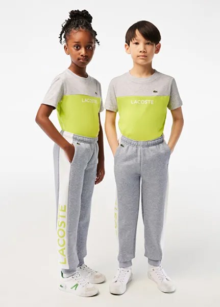 Детские серые спортивные штаны с цветными блоками Lacoste