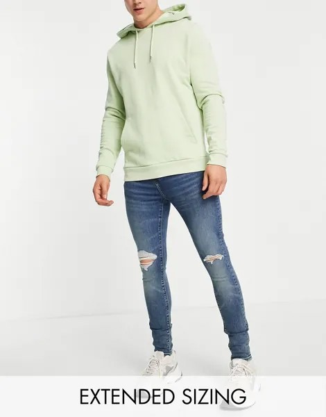 Окрашенные супероблегающие эластичные джинсы с рваными коленями ASOS DESIGN-Голубой