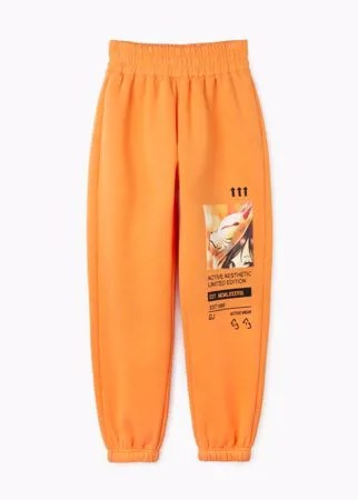 Оранжевые спортивные брюки Jogger с аниме-принтом и нашивкой для девочки Gloria Jeans