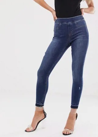Моделирующие джинсы скинни с рваной отделкой Spanx-Синий