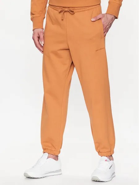 Спортивные брюки свободного кроя New Balance, оранжевый